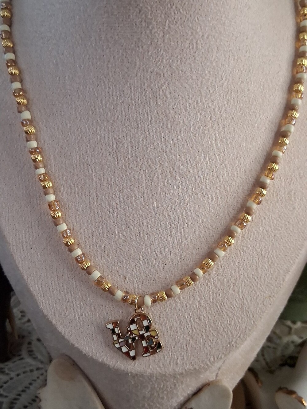Gold and Cream Beaded Necklace with Love Pendant